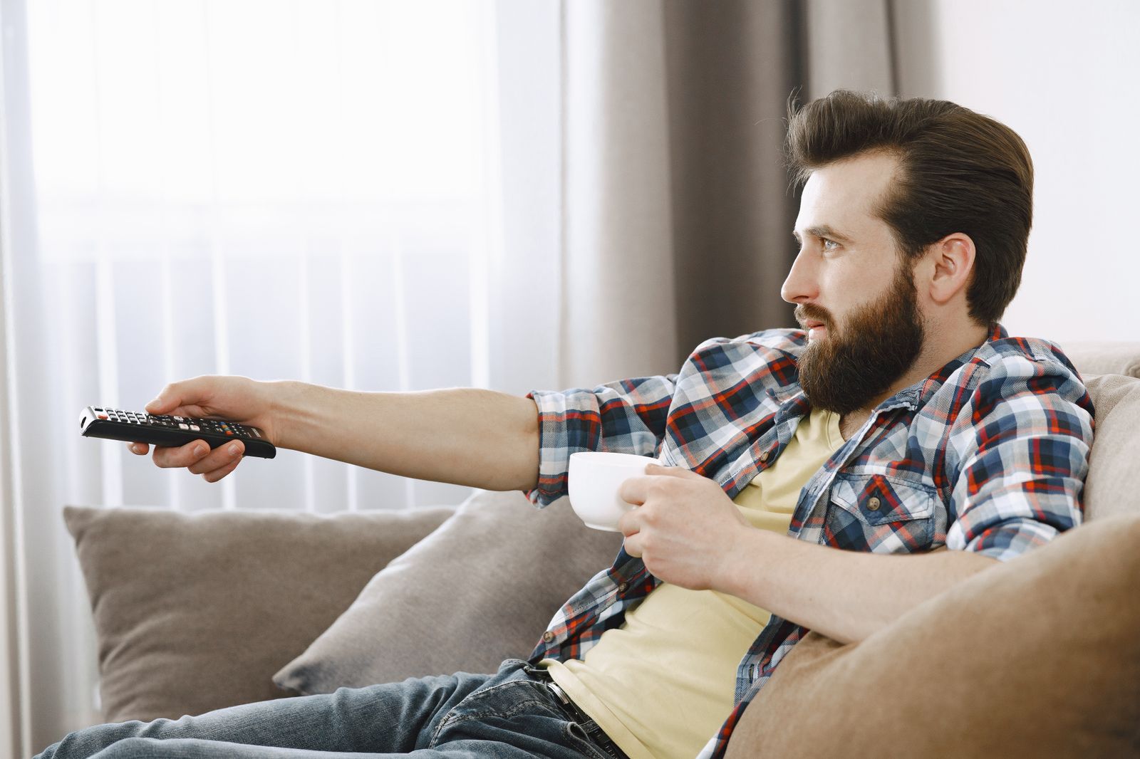 Person watching streaming content on a television at night